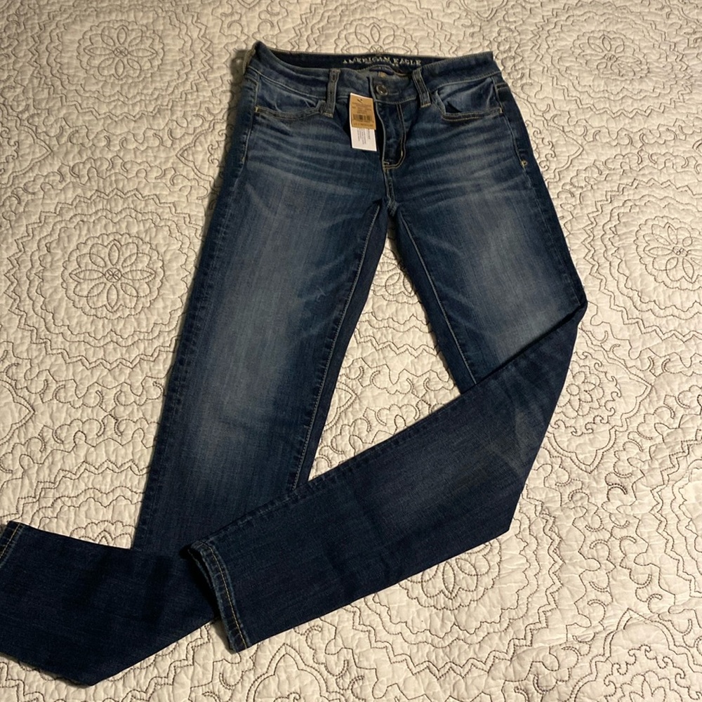 Women’s low-rise AE jeans, new